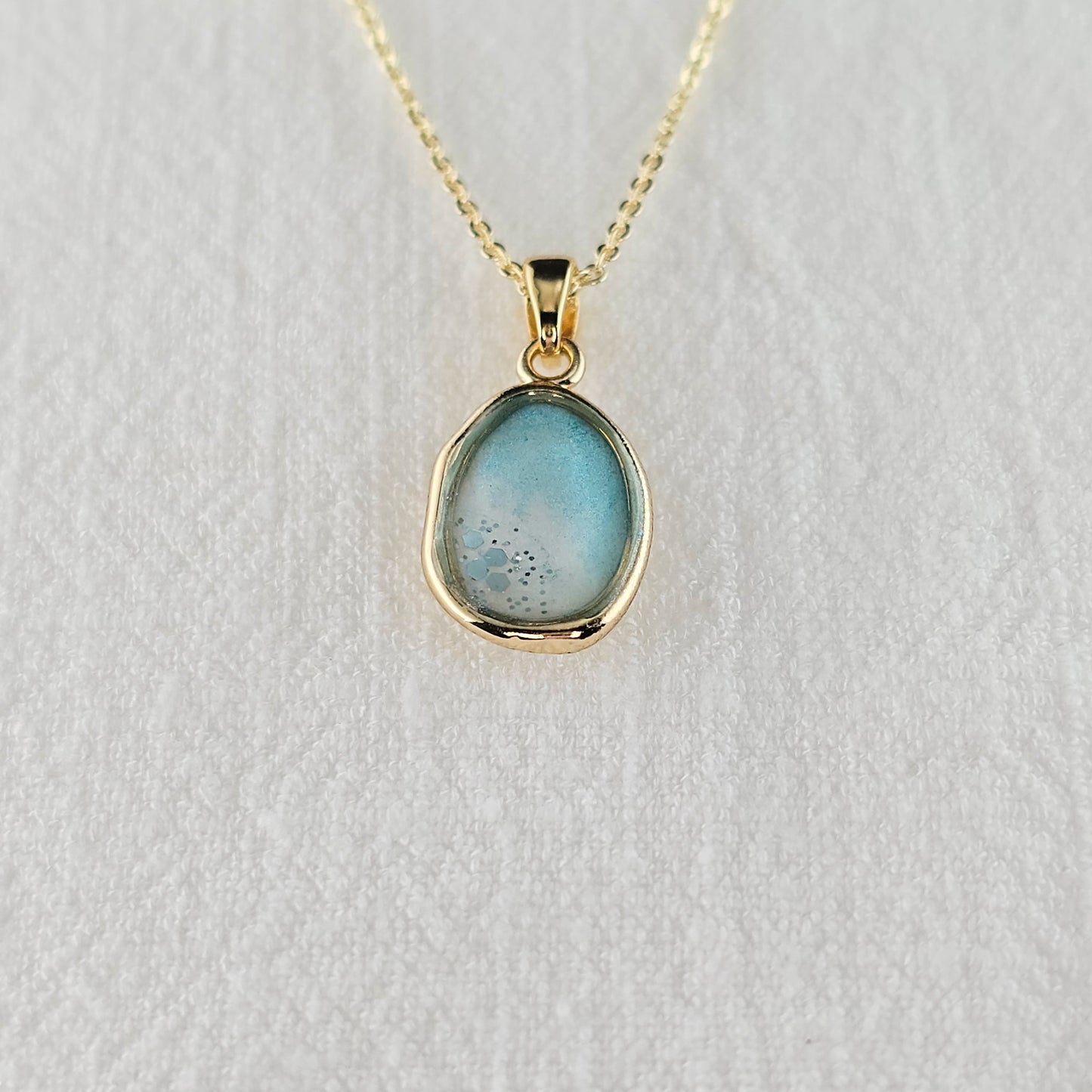 Handmade oval pendant with aquamarine and white shimmer and gold flakes, 14k gold plated chain, gift for her