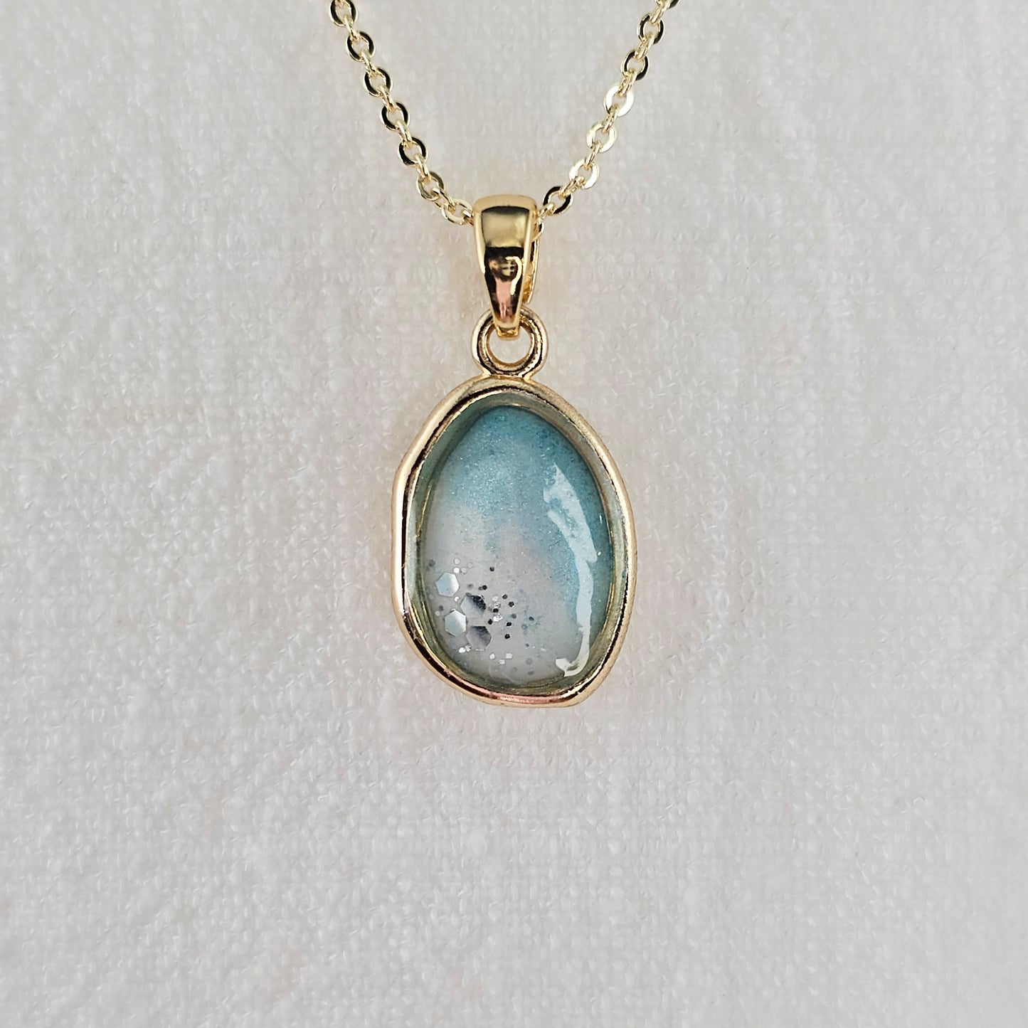 Handmade oval pendant with aquamarine and white shimmer and gold flakes, 14k gold plated chain, gift for her