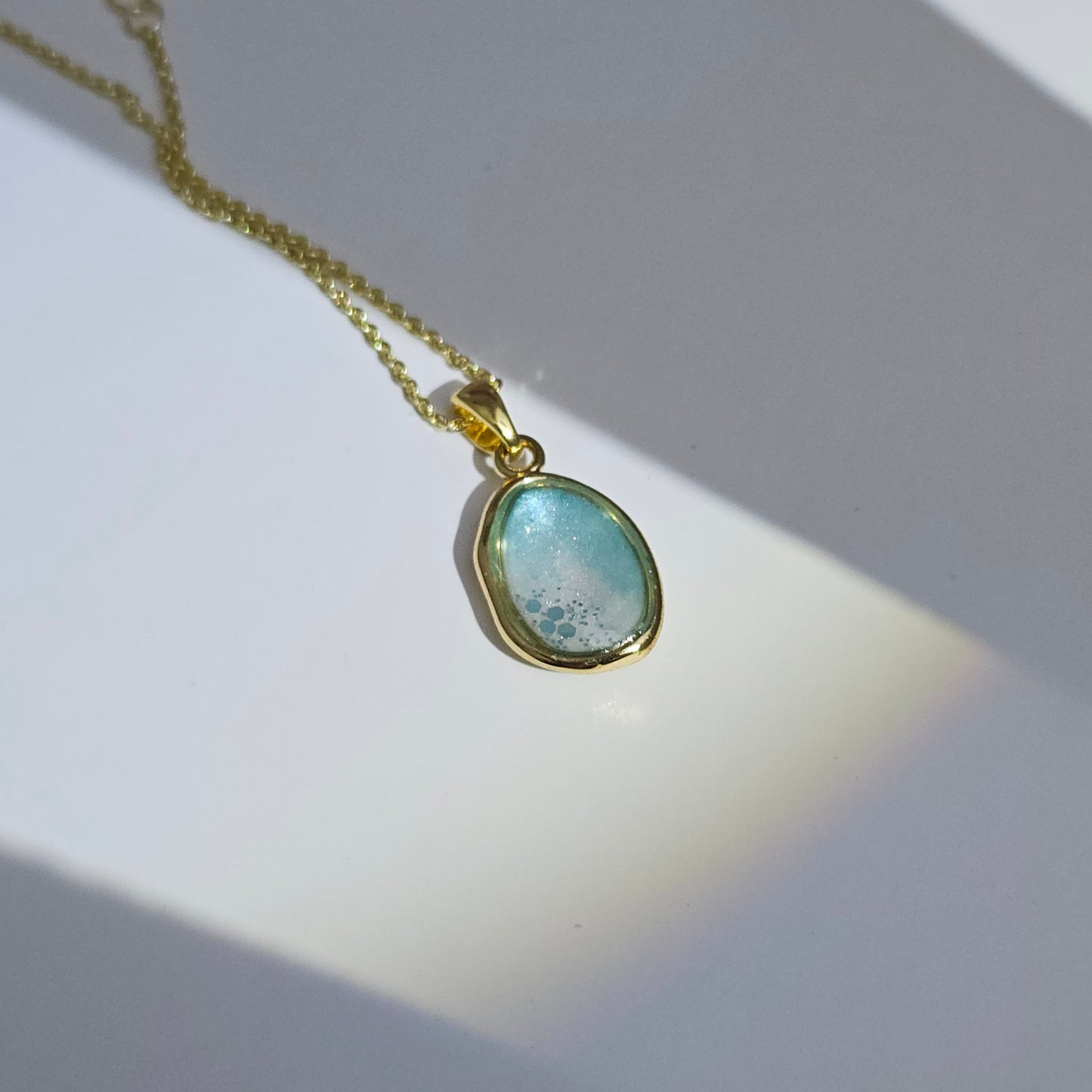 Handmade oval pendant with aquamarine and white shimmer and gold flakes, 14k gold plated chain, gift for her