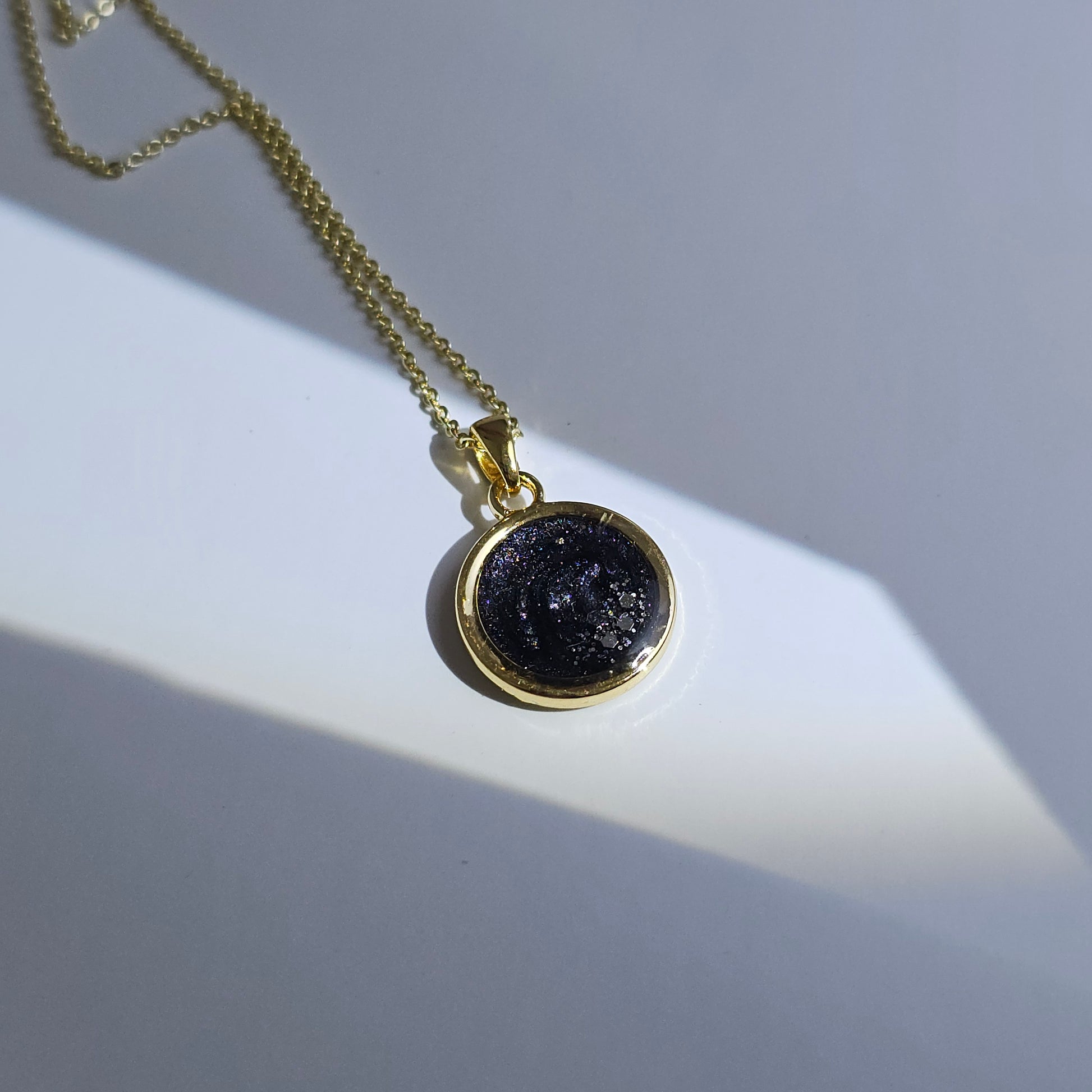 Handmade round pendant with black and grey swirls and silver flakes, 14k gold plated chain, gift for her